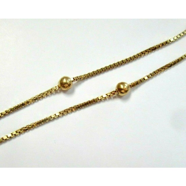 18K Yellow Gold 1.1 mm wide Box Chain Ball Necklace 24 Inches Long 1.1 MM wide 24 Inches long Necklace Beautiful box chain...