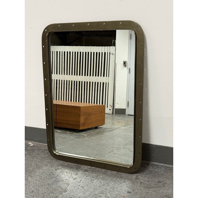 Design Plus Gallery presents a Pierced Metal Wall Mirror from Restoration Hardware Teen. This design has a rounded...