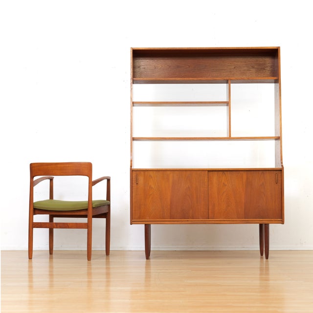This mid-century bookcase/room divider was designed in England during the 1960s. An elegant vintage example featuring a...