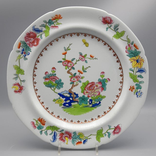 A pair of Spode plates, circa 1820. The central design is composed of flowering trees, sacred fungus, and a butterfly in...