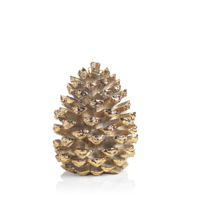 Bring a shimmering touch to your home décor with the Gold Pinecone figurine. This resin conifer cone figurine with gold...