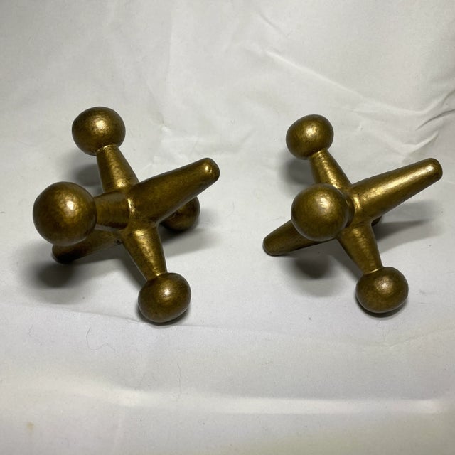 Pair of metal jacks bookends. Both are in good condition. In the style of Bill Curry, unsure if these are by the man himself.