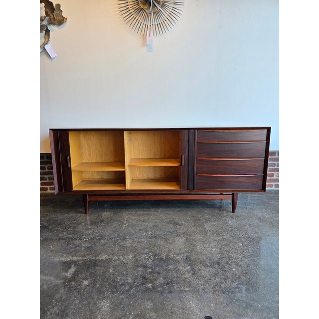 Beautiful Falster Rosewood Cabinet with Tambour doors. Refinished in a flat laquer, it's protected and ready to serve for...