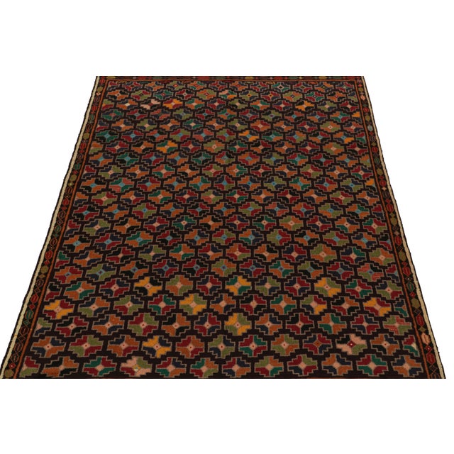 Hand knotted in wool, this 6x8 Baluch rug represents a new line of tribal carpets in the Modern Classics Collection by Rug...
