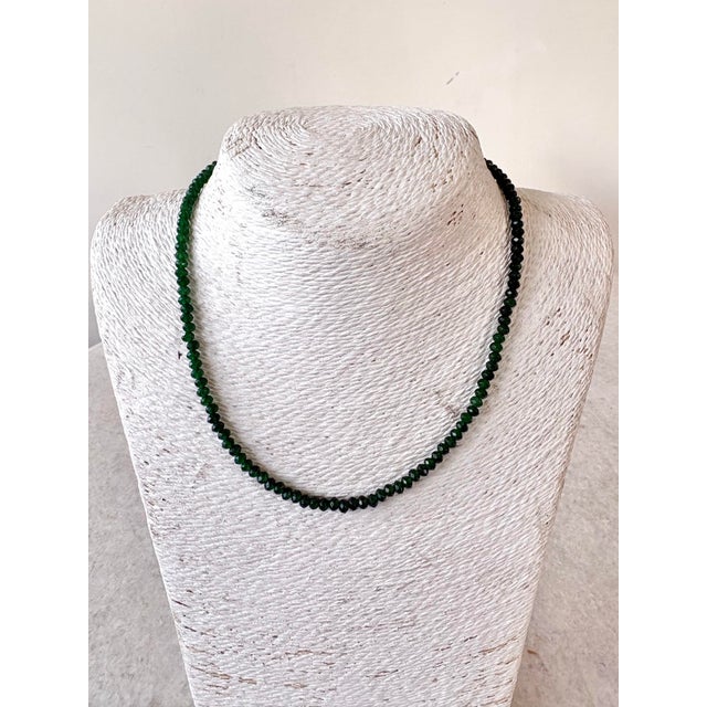 Lovely, faceted emerald quartz beaded necklace with gold tone metal clasp. Designed by Matthew Izzo