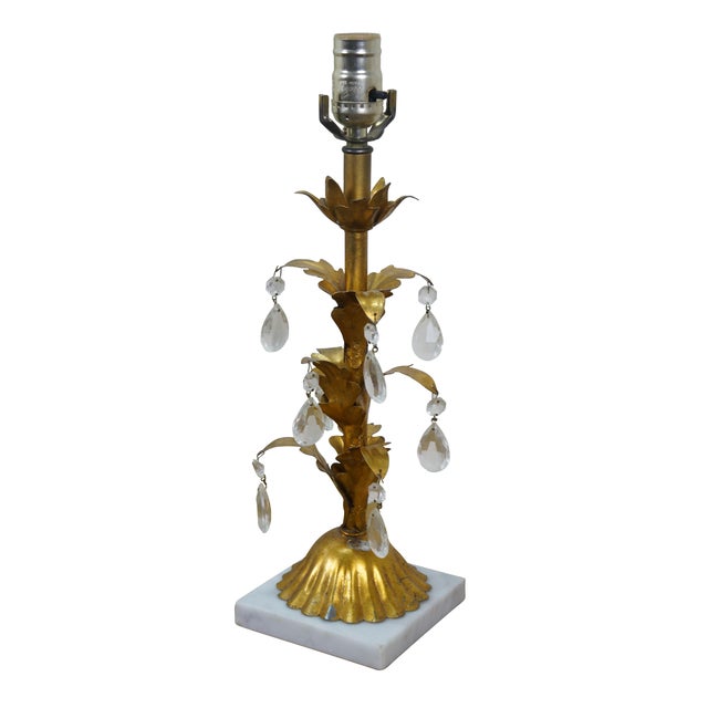 Mid 20th Century Hollywood Regency table lamps - columns of dropping leaves of gilt toleware, set on white marble bases,...