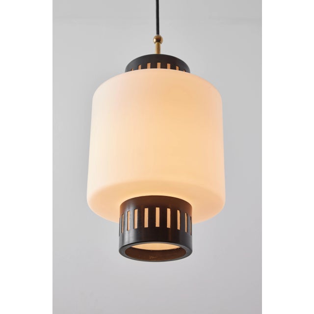 Large 1950s Stilnovo glass and metal pendant. A quintessentially 1950s Italian design executed in matte finish opaline...