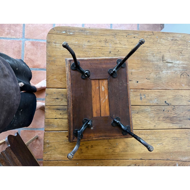 Bring a piece of industrial American craftsmanship into your home with this stunning Antique Cobbler's Shoe Shine...