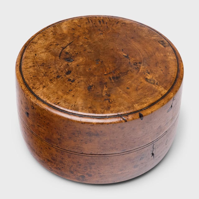 This elegant lidded box from the mid-19th century is carved from a choice specimen of burlwood, also known as yingmu or...