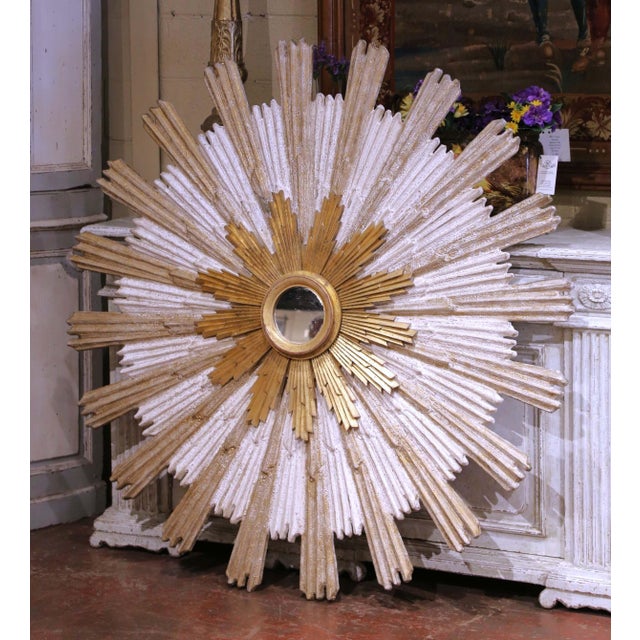 Add luminous presence and sculptural elegance to any interior with this monumental Italian sunburst mirror, crafted circa...