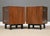 A pair of mid century modern walnut nightstands designed by George Nelson for Herman Miller. Professionally refinished....