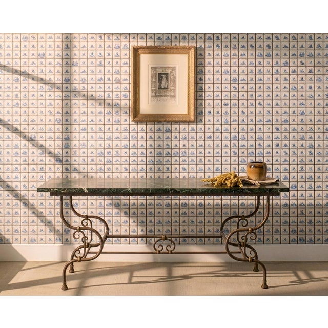 A charming French steel, marble, and bronze console table crafted in the style of Parisian pâtisserie or boucherie tables...