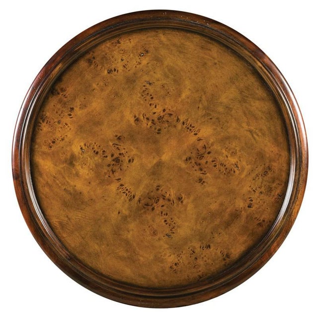 Adapted from the popular 19th Century English Regency style. This handy table has a round molded galleried top that is...