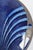 Art Nouveau pewter and enamel charger with a mottled cobalt-to-sky-blue fan/shell motif surface within a hammered pewter...