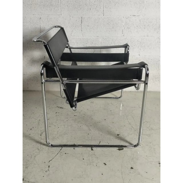 Italian mid-century Wassily black leather armchair by Breuer for Gavina, 1960s. Wassily Chair also known as Model B3, with...