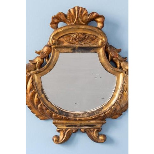 Height: 47 cm Width: 49 cm Some losses to gilding. Minor wear to mirror plate.