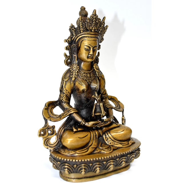 The beautiful bronze sculpture is of The Tibetan Amitayus, the Bodhissatva/Buddha of infinite life. Adorned with...