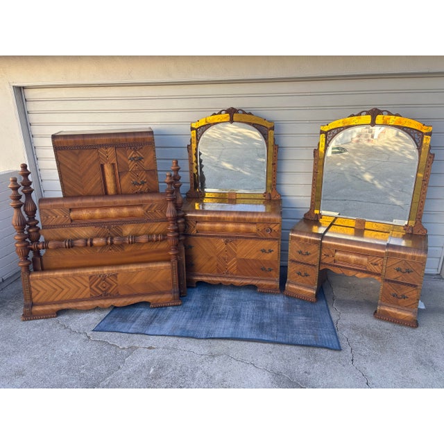 Vintage 1930s Art Deco waterfall bedroom furniture set featuring matching wooden grain veneer panels, curved edges, and...