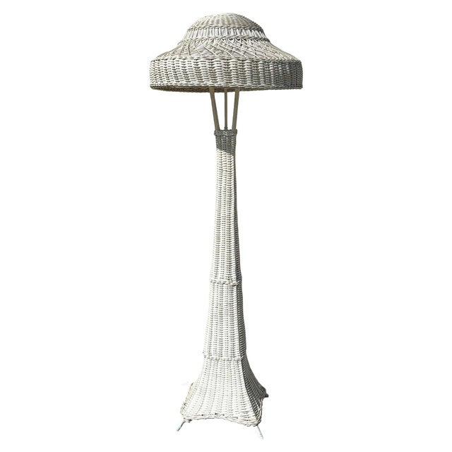Whited painted wicker and rattan floor lamp at 77 inches tall, the lamp features a beautifully hand-woven, oversized domed...