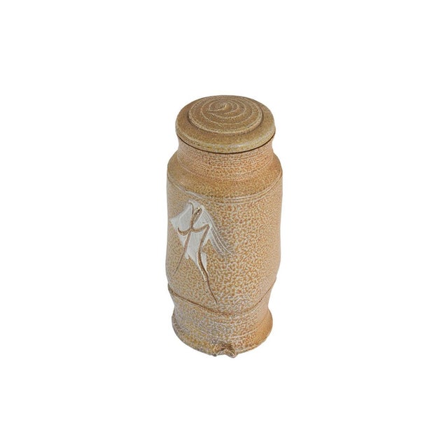 A studio pottery canister by the American artist June Skowronski Onesti (1940-2022). Signed "JSO" to the underside, the...