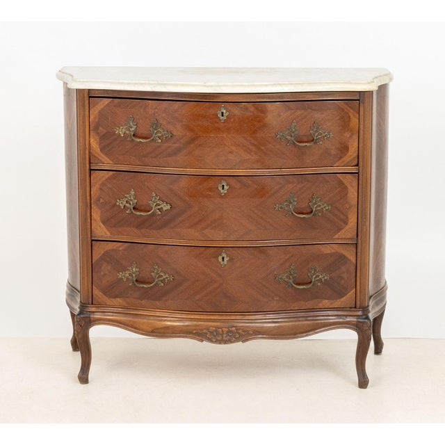 Louis XV Style Walnut Parquetry Commode, with white marble top above three drawers on four cabriole legs. 39.5" H x 44.5"...