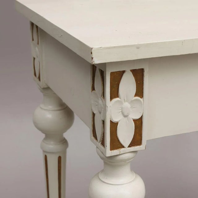 Console from the Swedish Renaissance around 1870. The ornaments of floral motifs and the harmony of gold trim colors speak...