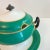 A striking vintage lidded sauce boat in crisp green and white porcelain with elegant gilded trim. The sculptural form,...