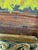 Design Plus Gallery presents a Still Life of a Marigold Cupboard in Acrylic Paint. The painting is signed and dated on the...