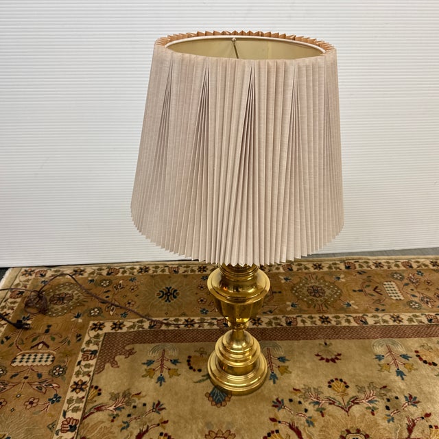 Design Plus Gallery presents a Stiffel Table Lamp. The lamp is from the mid to late 20th century and has cast brass body...