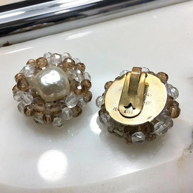 Beautiful pair of earrings by Coppola e Toppo from the 60s. The earrings have a clip with the typical pierced star back,...