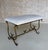 This magnificent mid century Spanish gilt iron bench was hand forged by skilled artisans and features an ornate base with...
