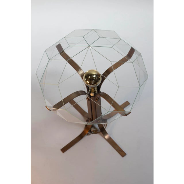 Incredibly rare Modernist table lamp in bronze with faceted jewel shade consisting of 40 pieces of cut glass. Manufactured...