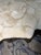 Fossilized coffee table in like-new condition. Inlaid fossilized clam shell on stonecast base made from a natural tree...