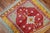 A Turkish Tulu rug with saturated colors in predominant red, blue gray and orange tones Measures: 3'6" x 3'10".