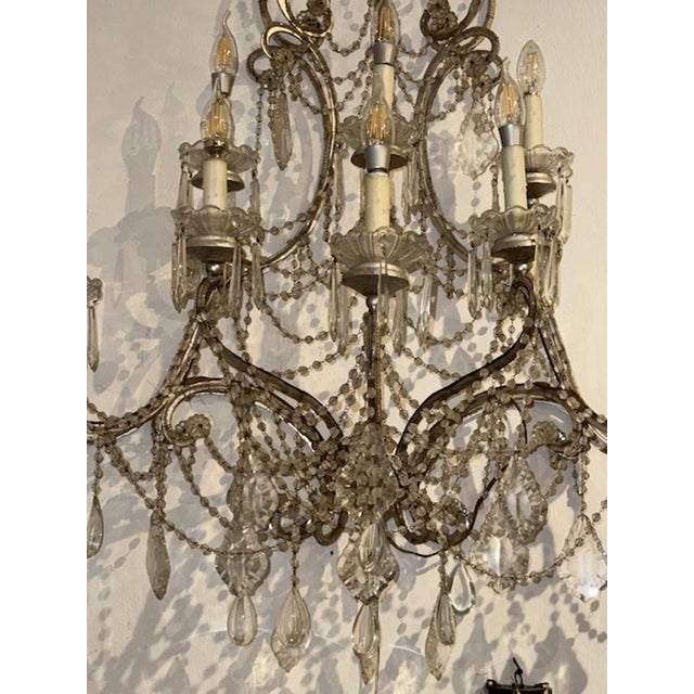 The large pair of antique Italian beaded sconces is a stunning addition to any home decor. These elegant wall fixtures...