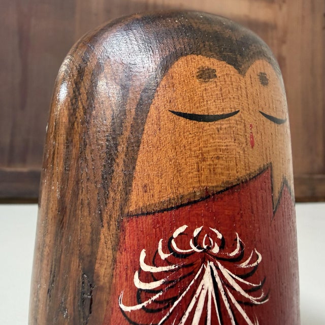 Special vintage sōsaku kokeshi from the 1970s, created by Oizumi 大泉. The doll has a compact, rounded form and a striking,...