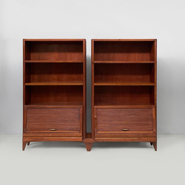 Italian mid-century modern sideboard in wood, 1960s Sideboard composed of two modules, made entirely of wood. Each module...