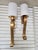 Fine Arts handcrafted lighting. Features a dramatic curved metal arm in a gold leaf finish. A single light fixture with a...
