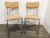 A pair of vintage Mid Century Modern armless chairs with cantilevered chrome tubular frame, reupholstered with a cork fabric.