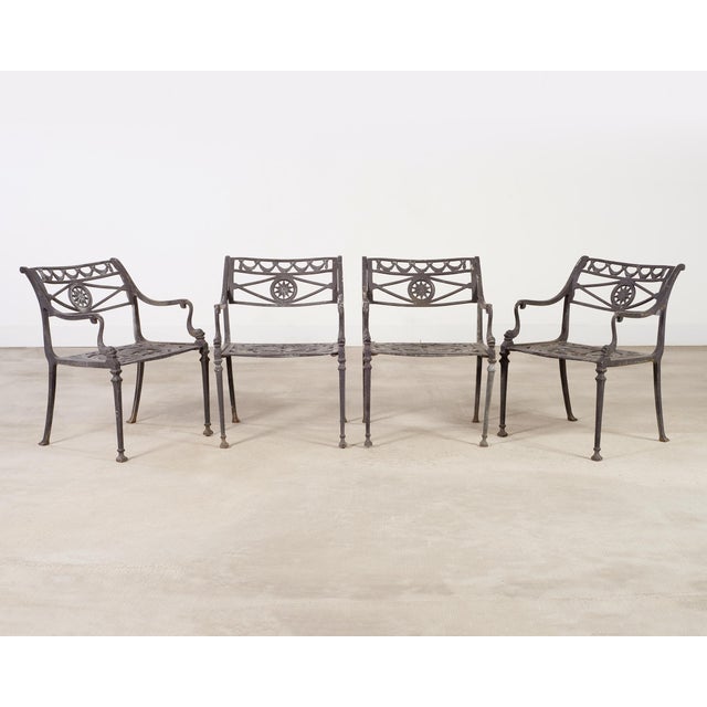 Iconic set of four dolphin and star patio and garden dining armchairs attributed to Kenneth Lynch and Sons, Oxford, CT....