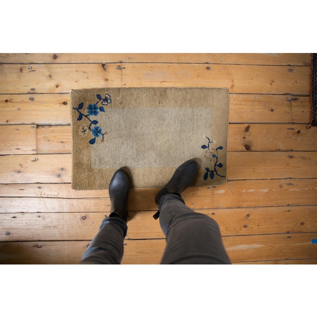 :: Unusual small open field Peking, possibly a sampler rug with main field absent of any design, a wide banded main...