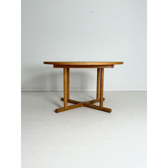 Kurt Østervig – Round Oak Dining Table, 1950s–60s Rare and elegant round dining table designed by Kurt Østervig in the...