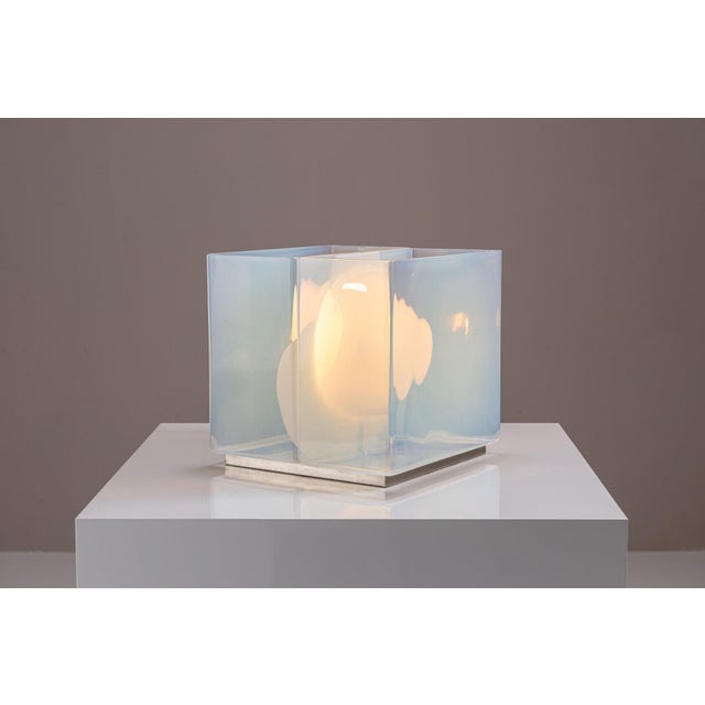 A study in material contrast and spatial interplay, this lt323 table lamp by carlo nason exemplifies the poetic clarity of...