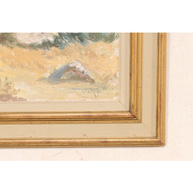 A Swedish framed painting of a landscape from the mid 20th century. This mid-century painting from Sweden depicts a...