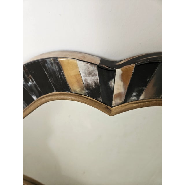 Beautiful vintage 1970s Horn mirror in a graceful Quatrafoil Shape. Great looking statement piece.