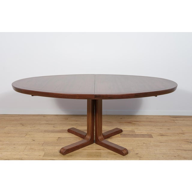 This extending dining table was manufactured in the 1960s by the Danish furniture maker Skovby Møbelfabrik A/S. The...