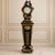 Make a dramatic statement with this grand French-inspired pedestal clock, featuring a striking black finish enhanced by...