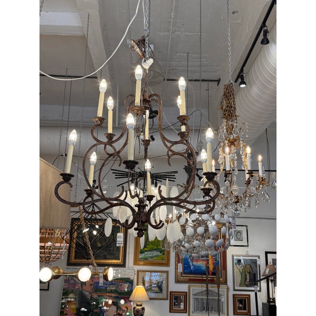 Design Plus Gallery presents the Julian Chandelier 12 Light Chandelier from Iatesta. This wrought iron chandelier pairs...