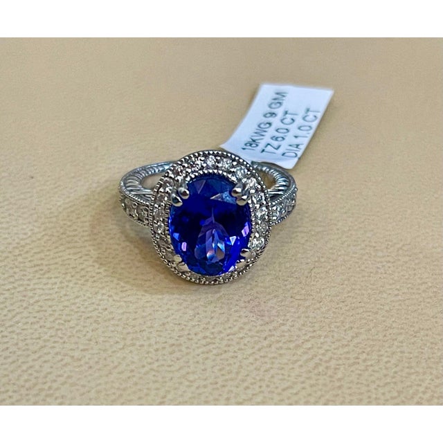 6 Carat Oval Tanzanite and 1 Carat Diamond Ring 14 Karat White Gold, Estate For Sale In New York - Image 6 of 18
