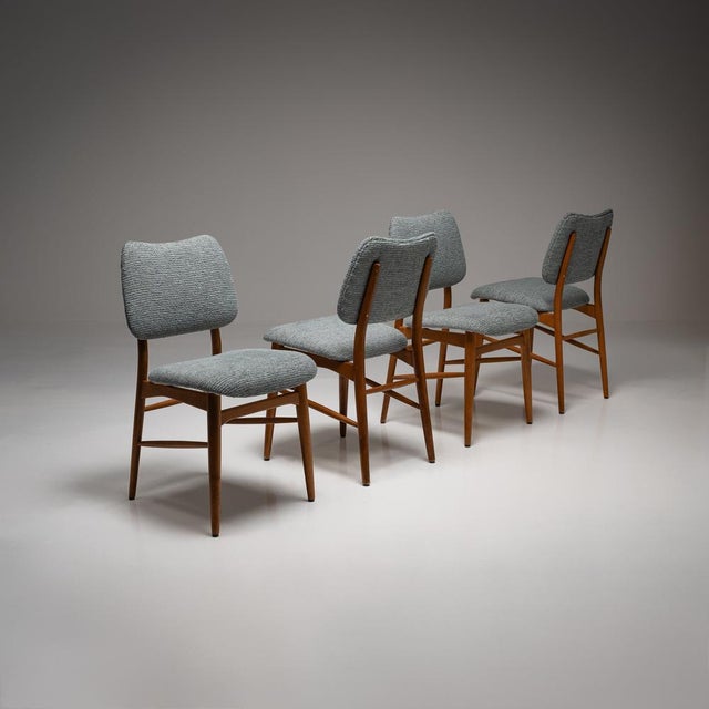 These mid-century dining chairs are a perfect example of the timeless elegance and functional design of this period. These...